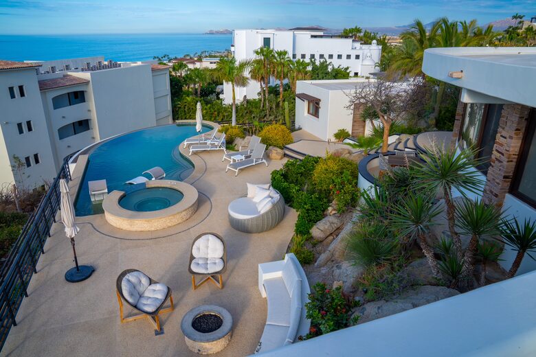 Backyard with ocean view, pool, spa and fire pit. View from the roof.