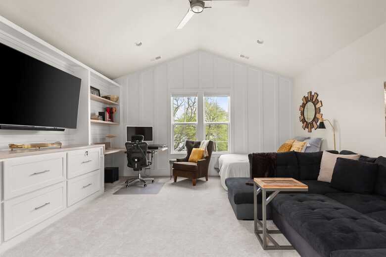 spacious bonus room, queen bed, huge sofa, blackout blinds