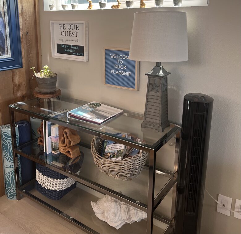 Console table with guest guide book and other reading.