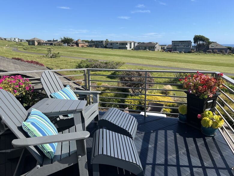 Seating for two at primary balcony.