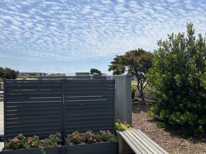 Privacy screen with planters at hot tub.
