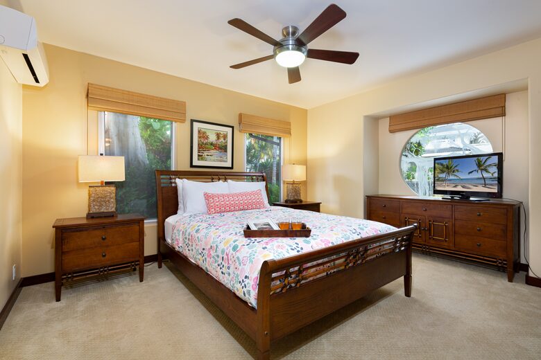 Downstairs bedroom with a queen bed