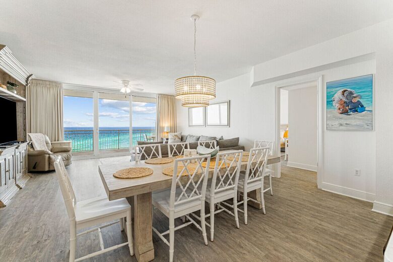 8 seats at dining table with view of ocean