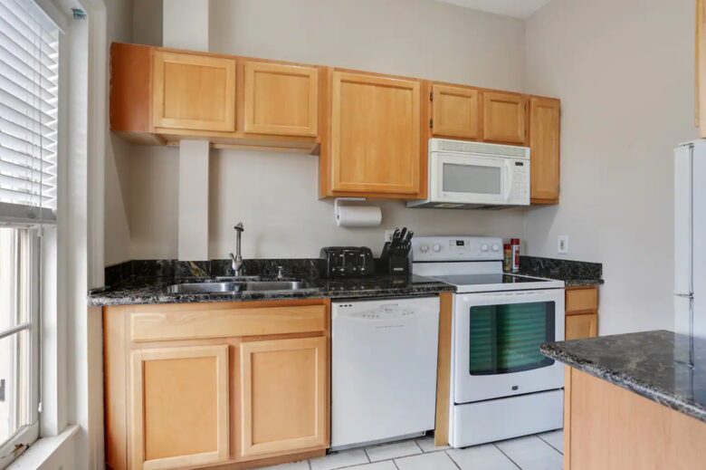 The full kitchen features modern appliances