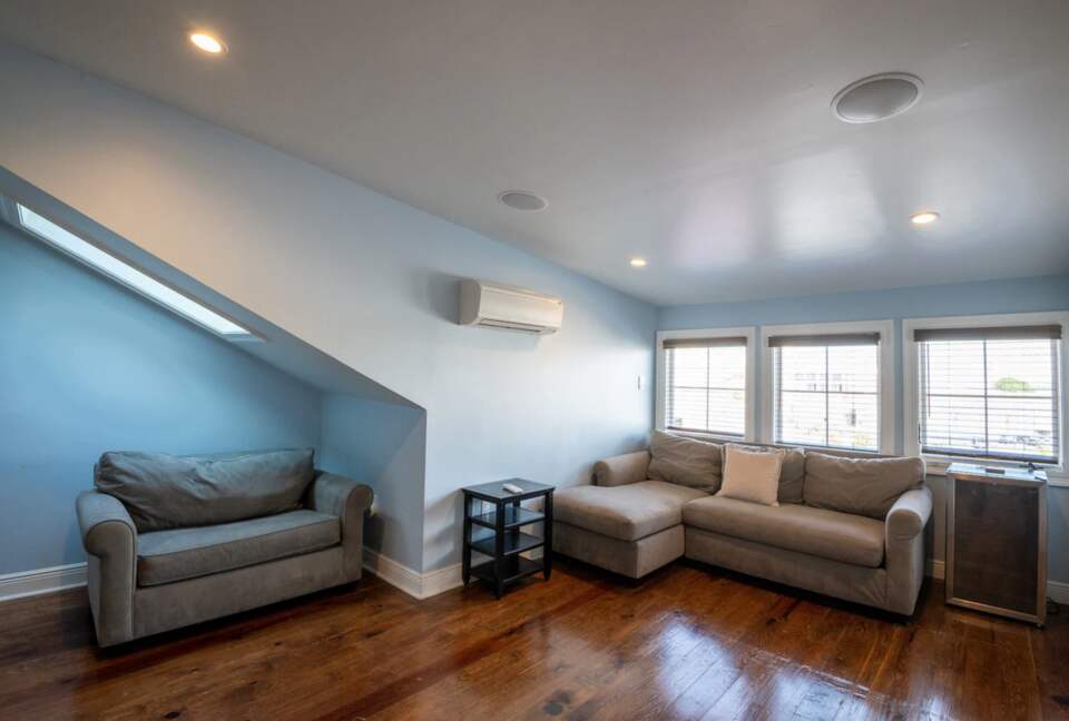 This bright, spacious living room features a large sectional sofa