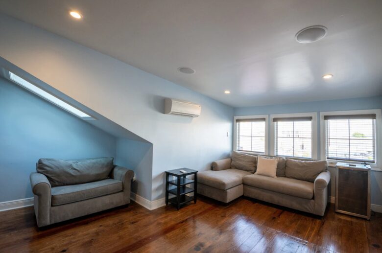 This bright, spacious living room features a large sectional sofa