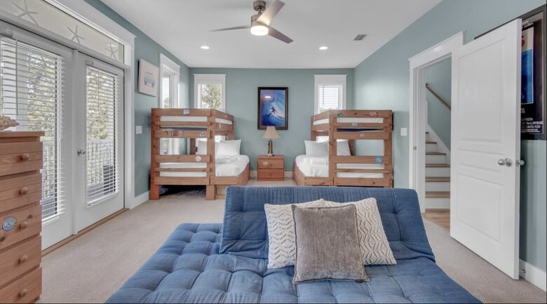 Bunk room has 2 sets of bunks, a futon, and a private balcony