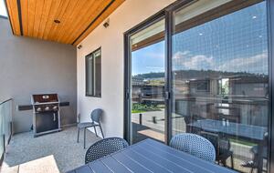 The balcony off the kitchen has a grill with gas line.
