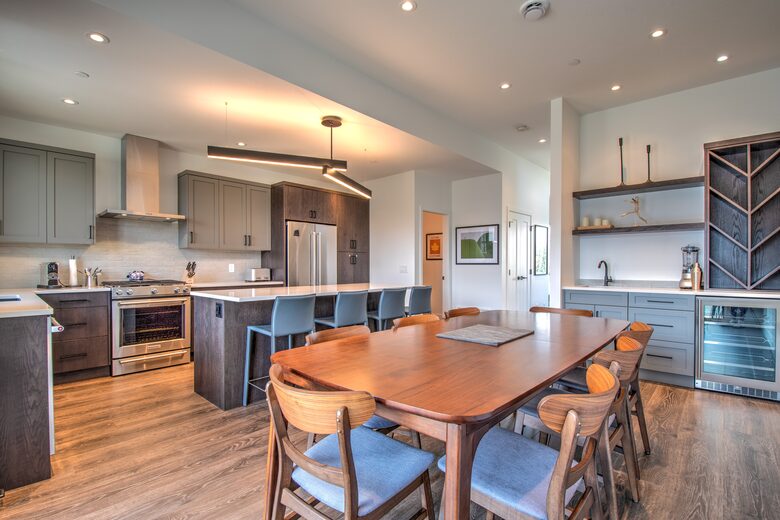 The kitchen table has seating for 8 plus a large island