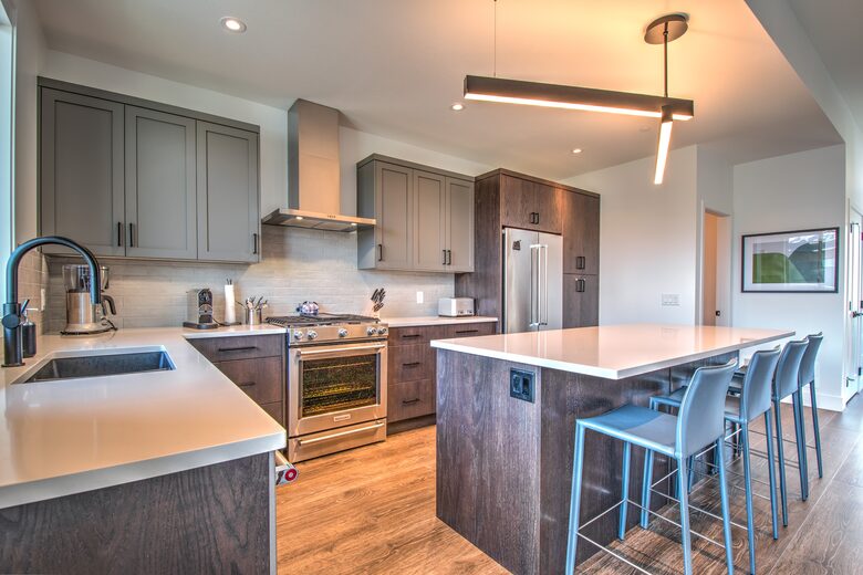 The modern kitchen is fully stocked with amenities