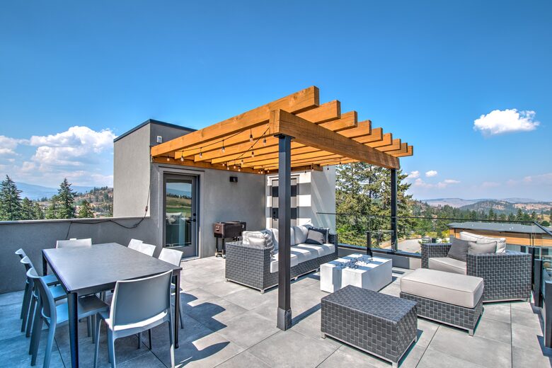Roof deck has dining for 8, plus comfy furniture