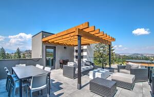Roof deck has dining for 8, plus comfy furniture