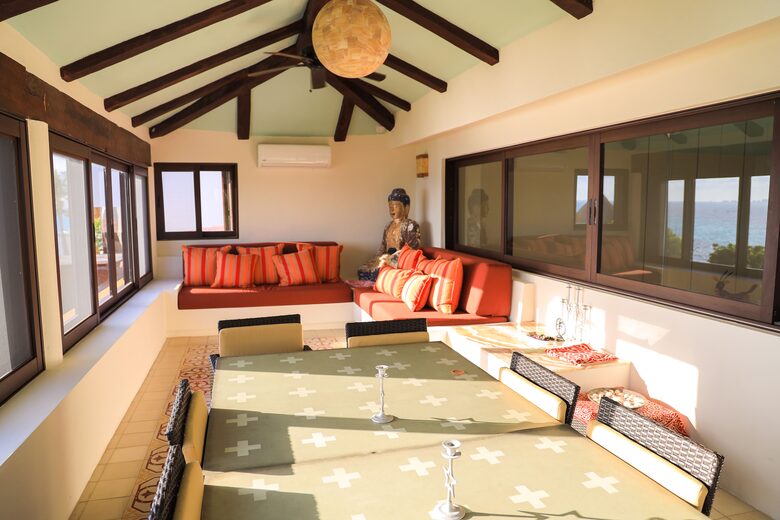 Indoor relaxation room with screened windows and A/C