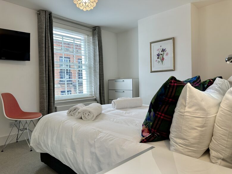 Bedroom 2 with wall-mounted Smart TV and Kingsize bed