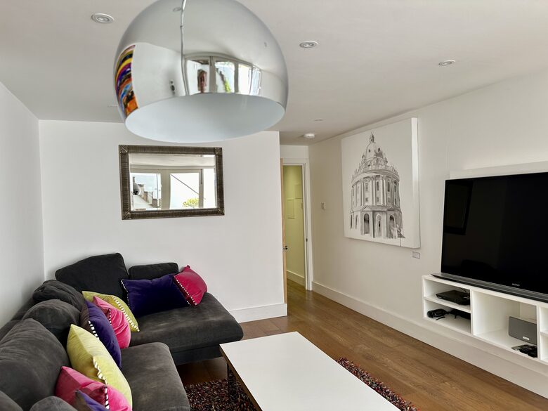 Living room with Smart TV and original artwork