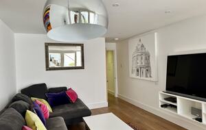 Living room with Smart TV and original artwork