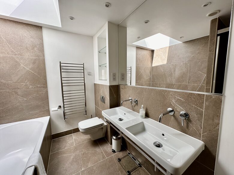 Bathroom 1 with bathtub, separate shower and double sink
