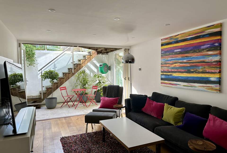 Living Room with steps up to the garden