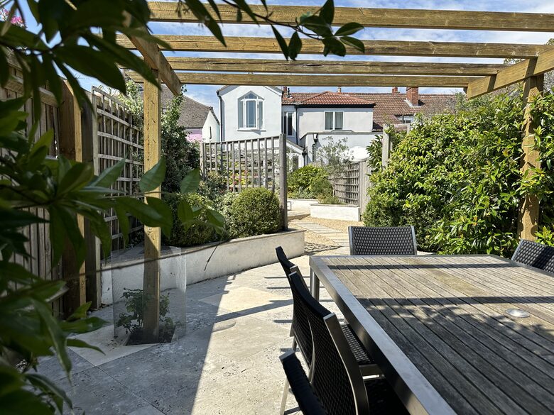 Under the pergola