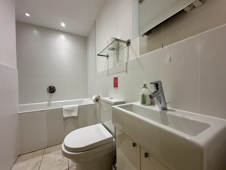 Second bathroom with over-bath shower