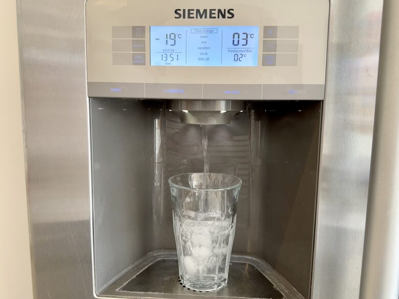 Fridge freezer has ice and water dispenser
