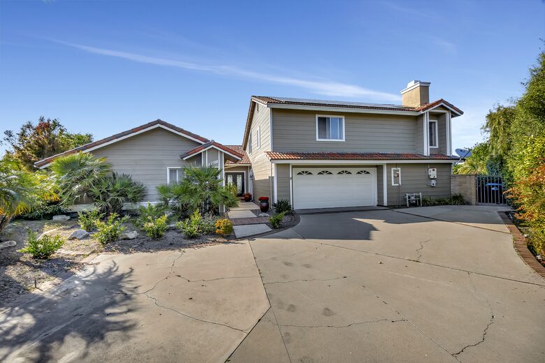 Long driveway that can accommodate 4-5 cars plus one in garage.