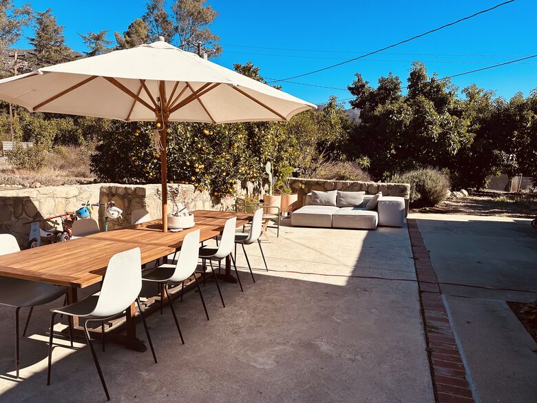 Front Patio, Large Dining Table and Sofa adjacent to orchards