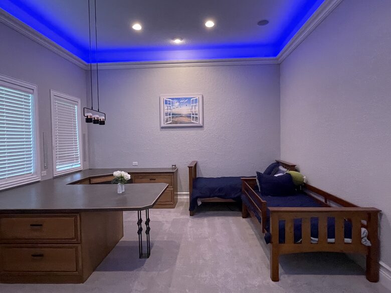 Next to the master bedroom is a first floor play area with twin Beds