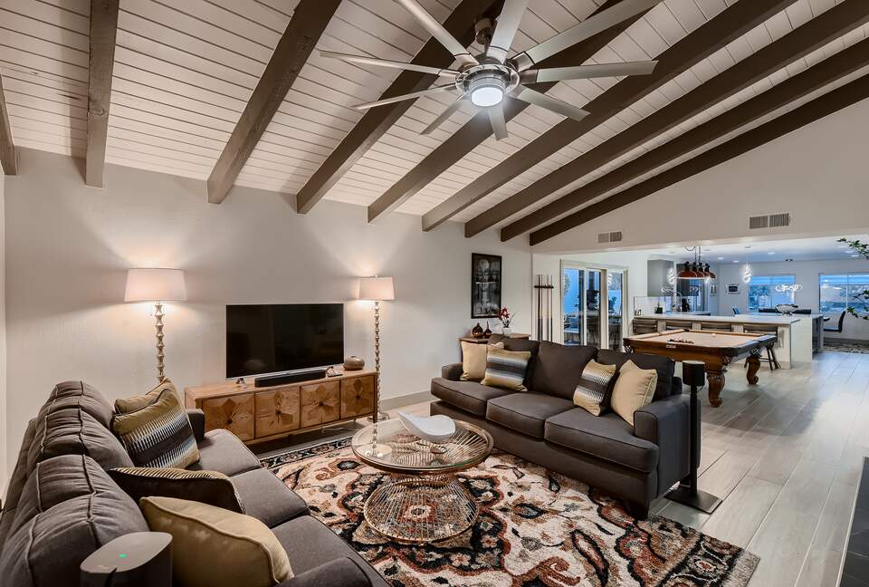 Living room, pool table & chef's kitchen