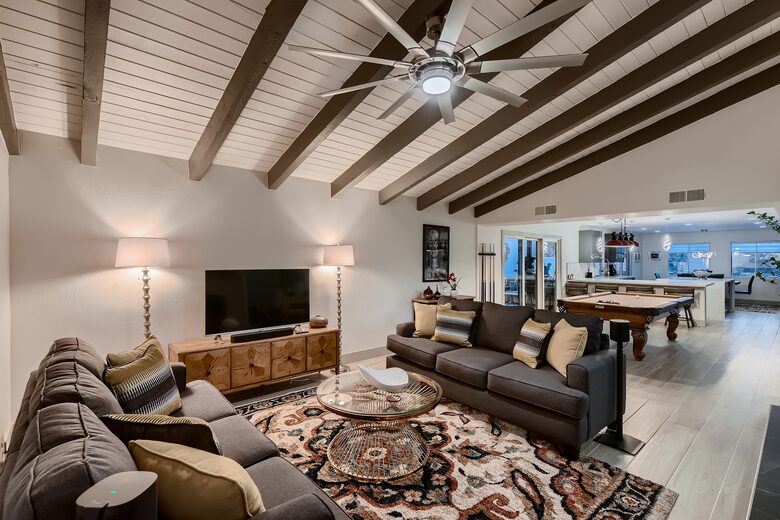 Living room, pool table & chef's kitchen