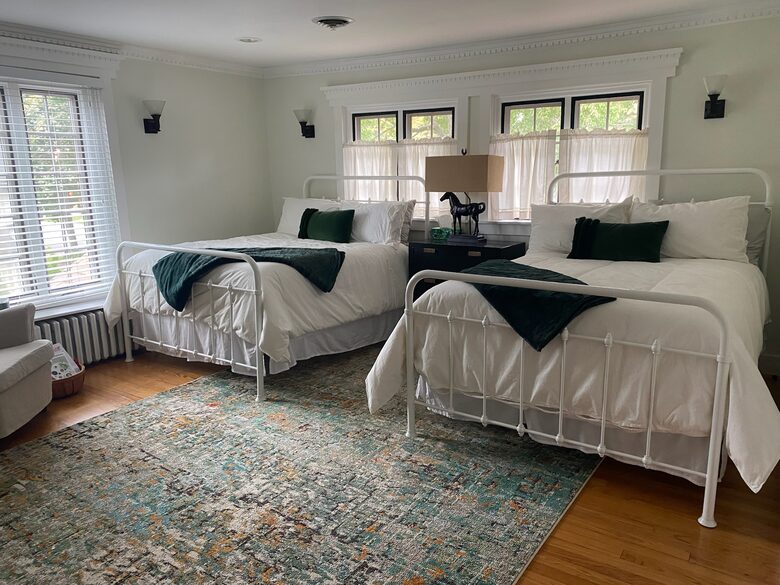Front bedroom with 2 double beds and en suite juccuzzi tub