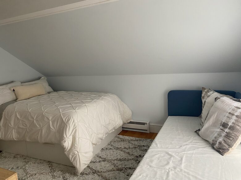 Side room with double bed, single bed, en suite bath and balcony