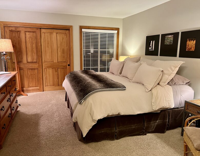 Master bedroom suite with king sized bed on main level