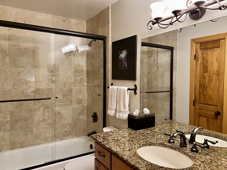 Main level bath adjacent to Bedroom 2