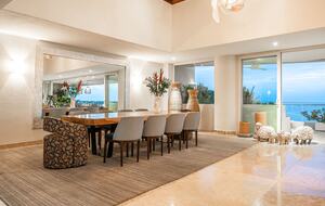 A/C indoor dining for 10 at massive parota wood table