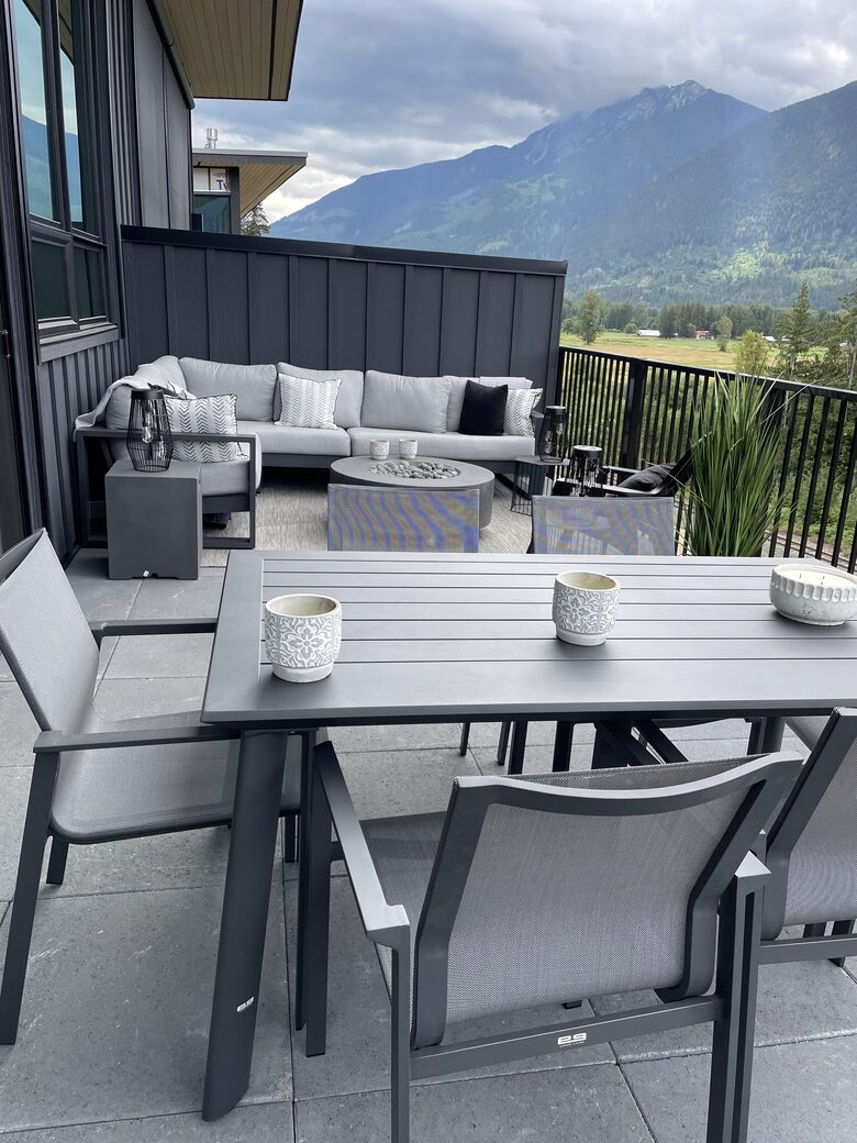 Main floor deck with fire pit, seating ,dining and BBQ.