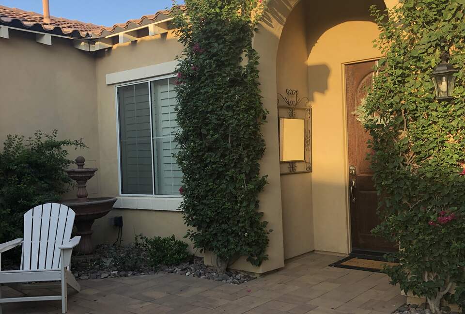 Courtyard entry with outdoor fireplace and sitting area