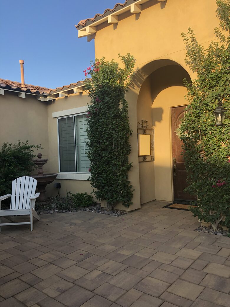 Courtyard entry with outdoor fireplace and sitting area