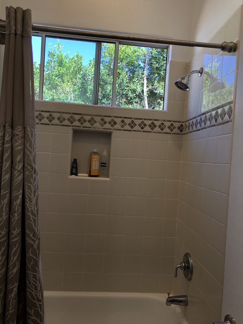 Tub shower in family suite bedroom