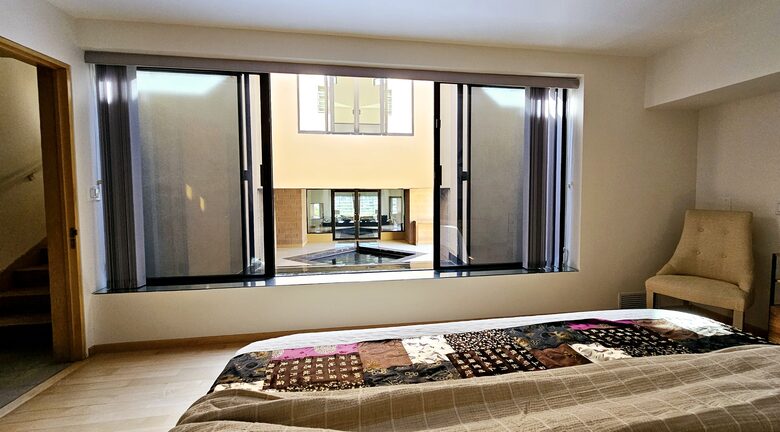 Bedroom 2 with opening to fountain pool