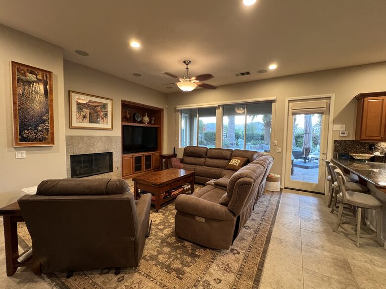 Family room, fireplace sectional, recliner, large screen TV, streaming