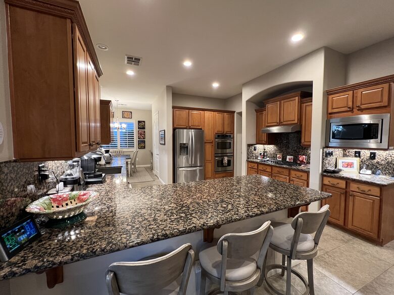 Kitchen, barstools, gas range, double ovens