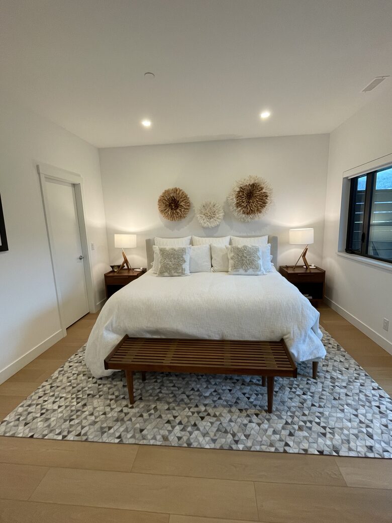 Primary bedroom with king bed and walk-in closet