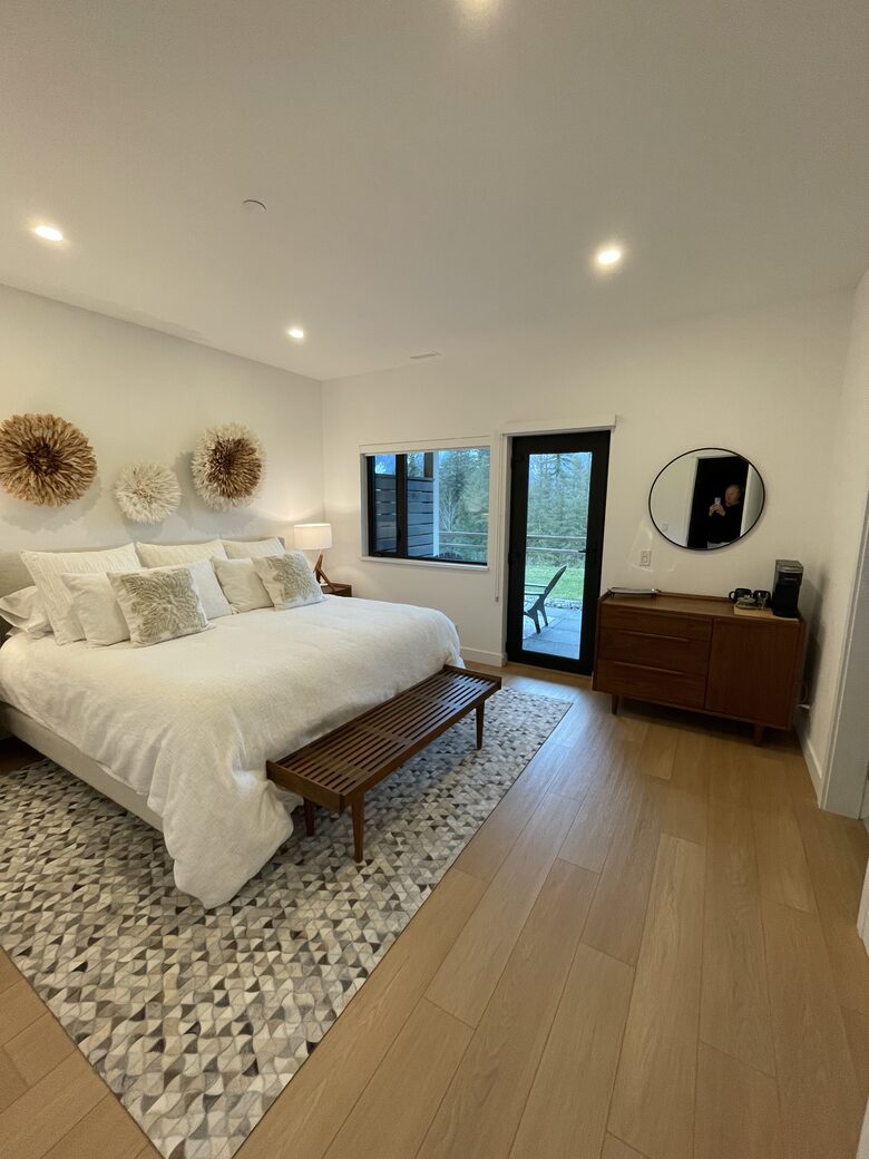 Primary bedroom with access to lower deck and hot tub
