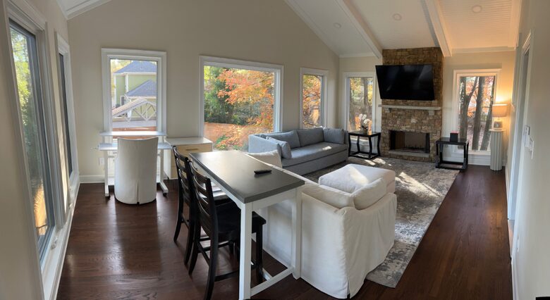 300 SF sunroom with work area, gas fireplace, and pull-out full bed
