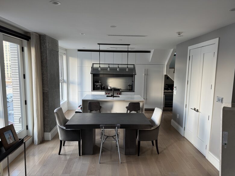 DR, kitchen on 1st fl. Floor-ceiling windows facing NYC, sunset views
