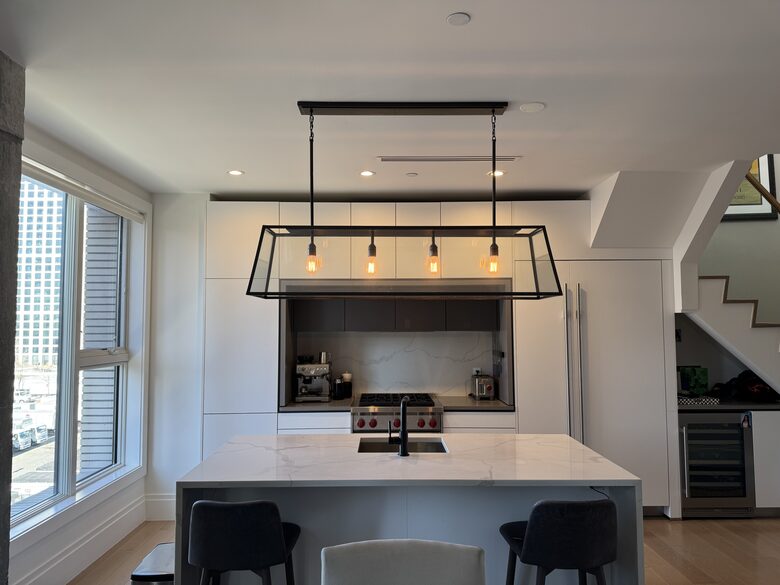 Kitchen on 1st fl. Floor-ceiling windows facing NYC, sunset views
