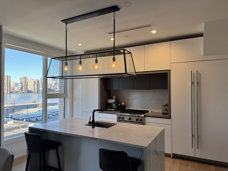 Kitchen on 1st fl. Floor-ceiling windows facing NYC, sunset views