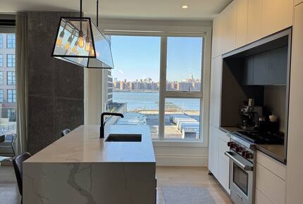 Kitchen on 1st fl.  Floor-ceiling windows facing NYC, sunset views