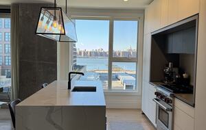 Kitchen on 1st fl. Floor-ceiling windows facing NYC, sunset views